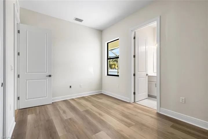 Guest bedroom 3 with luxury vinyl plank flooring