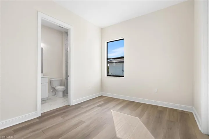 Guest bedroom 1 with vinyl wood plank flooring
