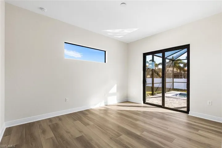 Master suite with sliders to the backyard oasis