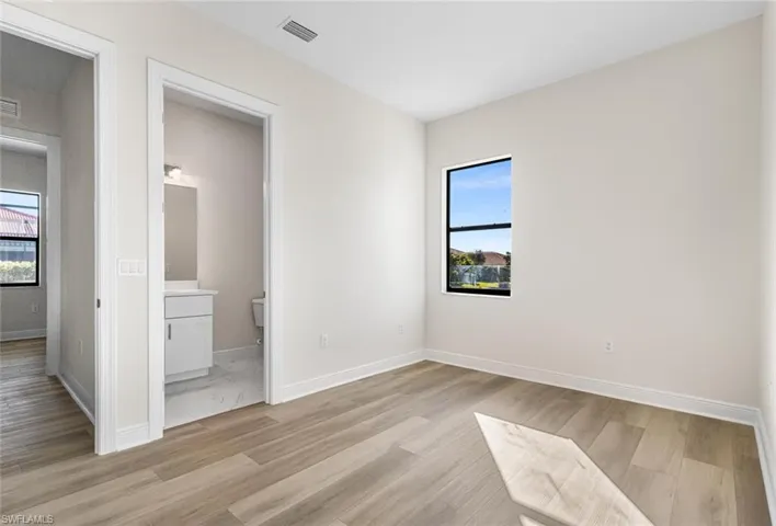 Guest bedroom 2 with luxury vinyl plank flooring