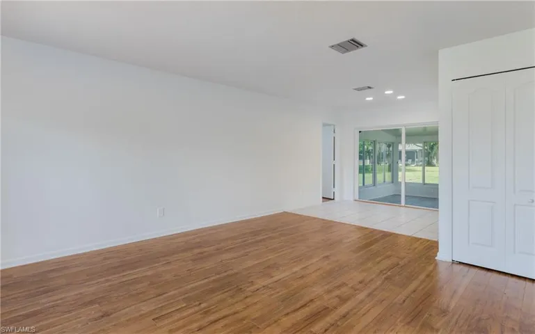 Spare room with light wood-style flooring and recessed lighting