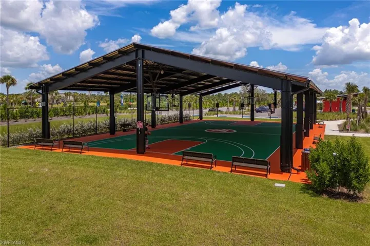 View of sport court with a yard and community basketball court