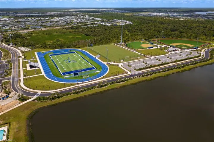 Aerial overview of property's location featuring a large body of water