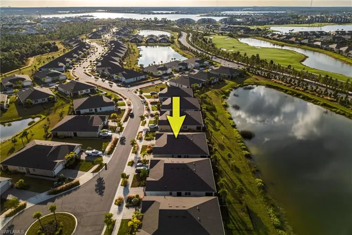 Aerial view at dusk of a water view and a residential view