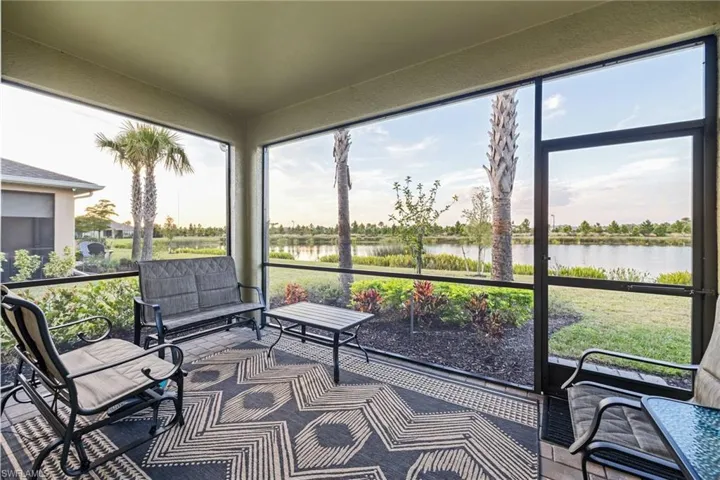 Sunroom / solarium with a water view
