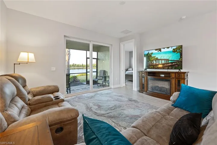 Living area with a fireplace and wood finished floors