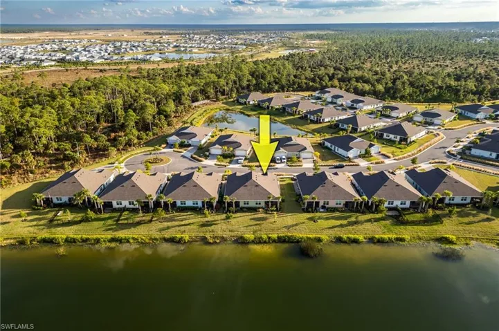 Aerial perspective of suburban area with a large body of water
