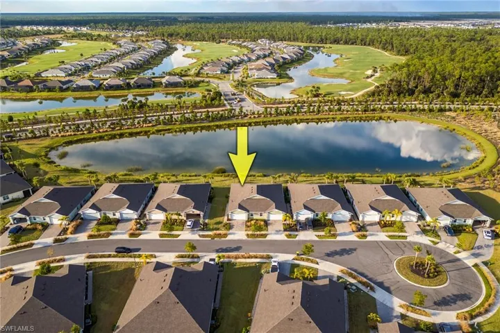 Aerial overview of property's location featuring nearby suburban area and a large body of water