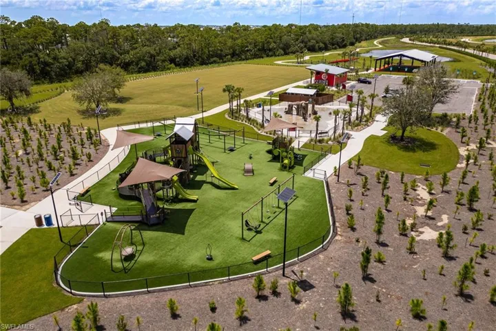 Drone / aerial view of a community park and a tree filled landscape