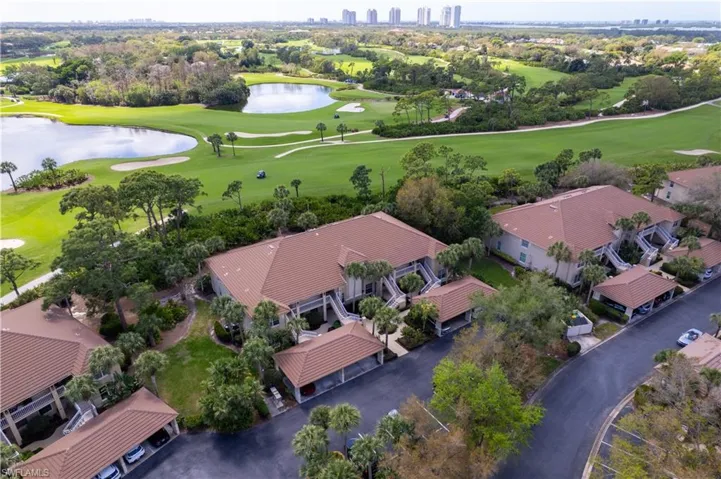 View of urban area featuring a local golf course and a nearby body of water