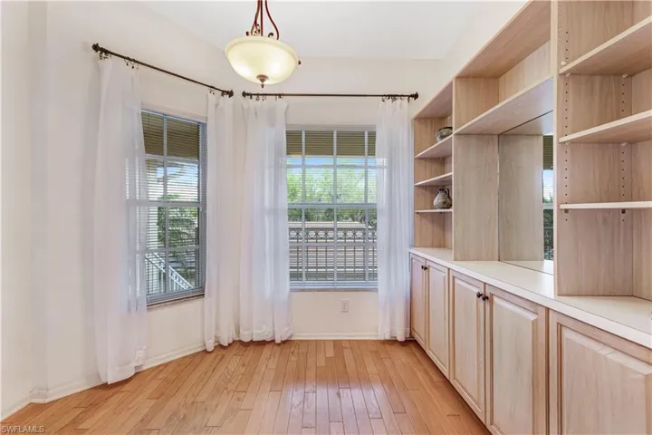 Unfurnished dining area featuring light wood finished floors and plenty of natural light