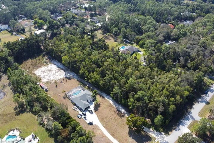 View of property location featuring a heavily wooded area