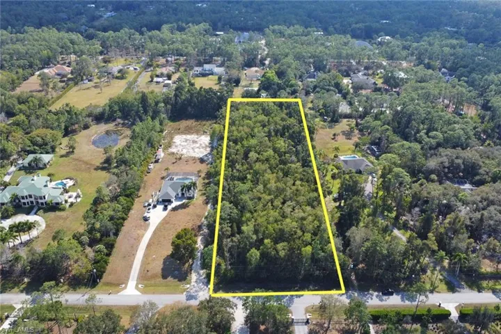 View of property location featuring property parcel outlined and a forest