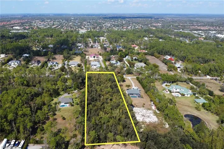 Aerial view of residential area with property boundaries highlighted