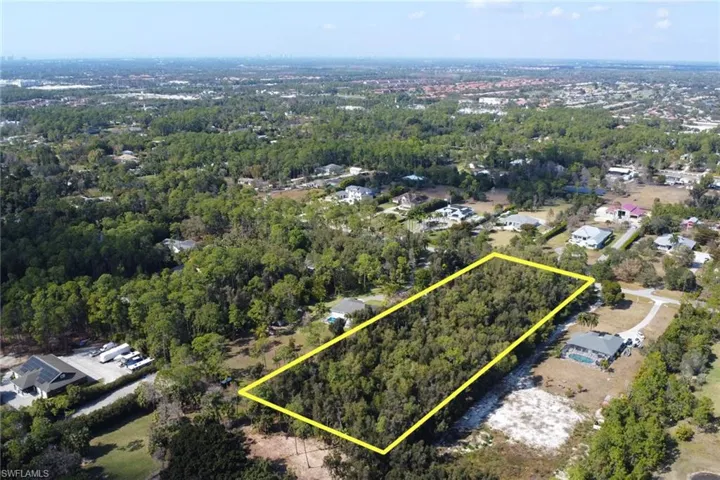 Aerial view of property's location featuring property parcel outlined