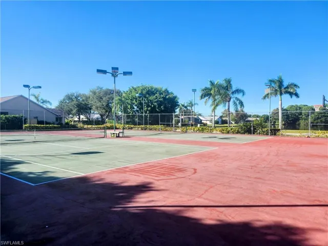 View of tennis court featuring community basketball court