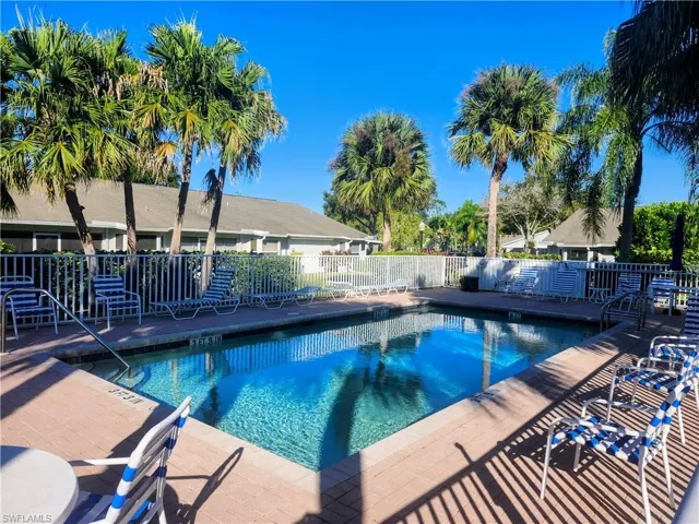 Community pool featuring a patio