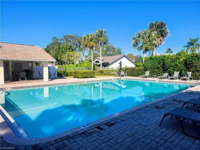 Community pool featuring a patio area