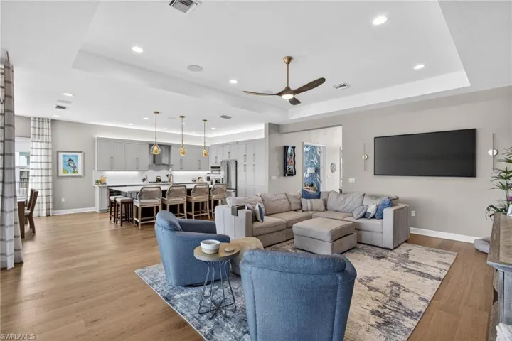 Open-concept living space featuring wood-finish flooring