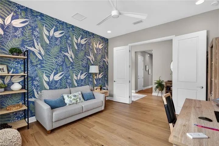 Accent wall featuring botanical-patterned wallpaper