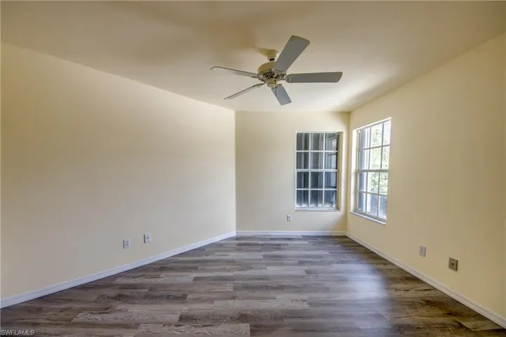 Spare room with ceiling fan and hardwood / wood-style floors