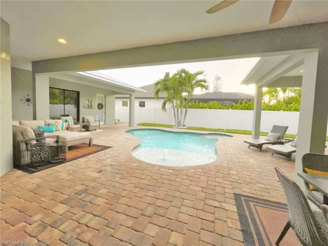 View of swimming pool with an outdoor living space and a patio