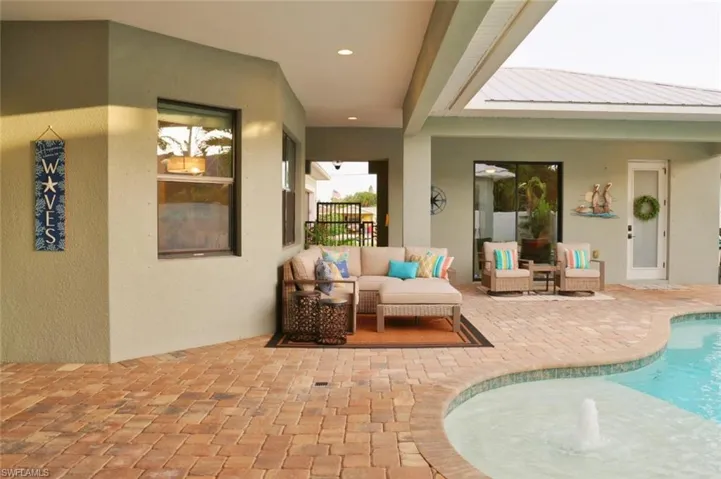 View of patio with an outdoor living space