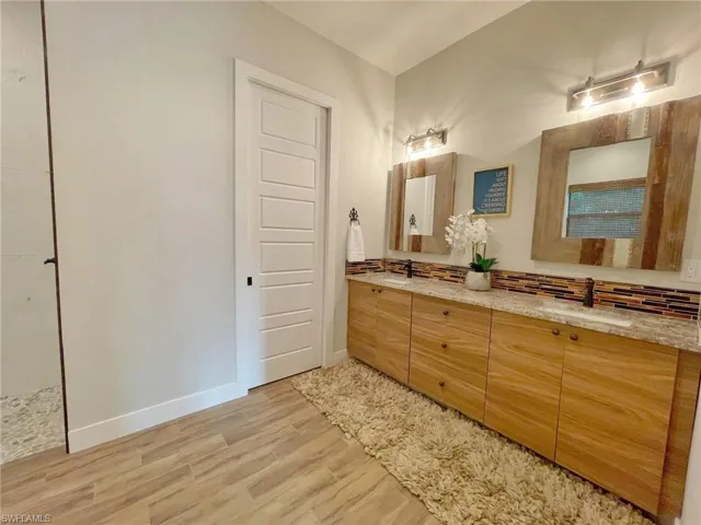Bathroom with wood-type flooring and vanity