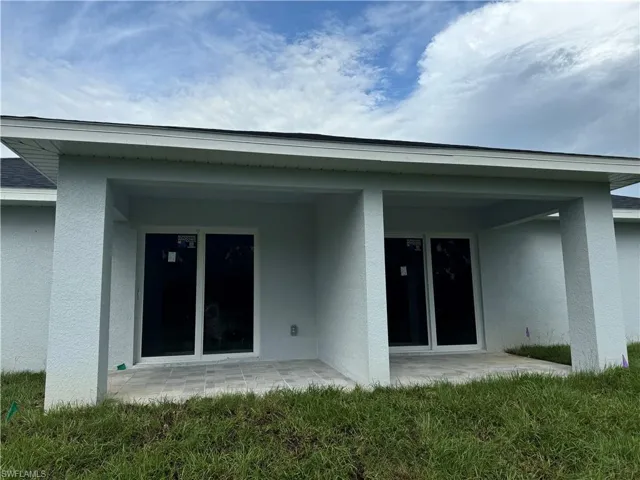 Rear view of property featuring a patio