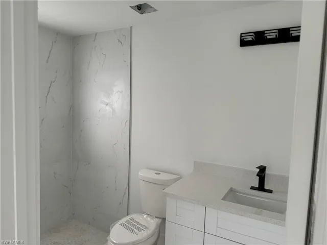 Bathroom with vanity and toilet