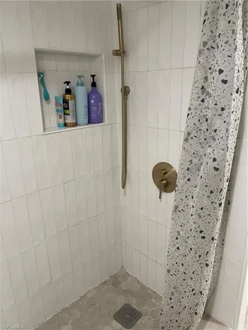 Bathroom with a shower with shower curtain