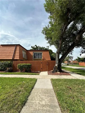View of side of home with a lawn