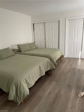 Bedroom featuring dark hardwood / wood-style floors