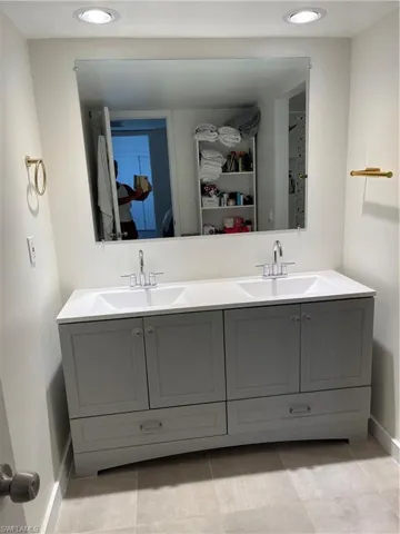 Bathroom featuring vanity and tile patterned floors