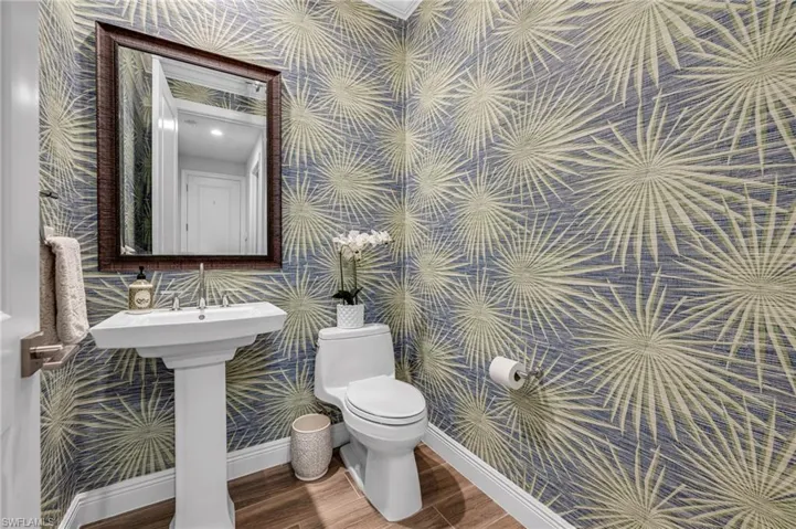 Powder Room features Winfield Thybony wallpaper