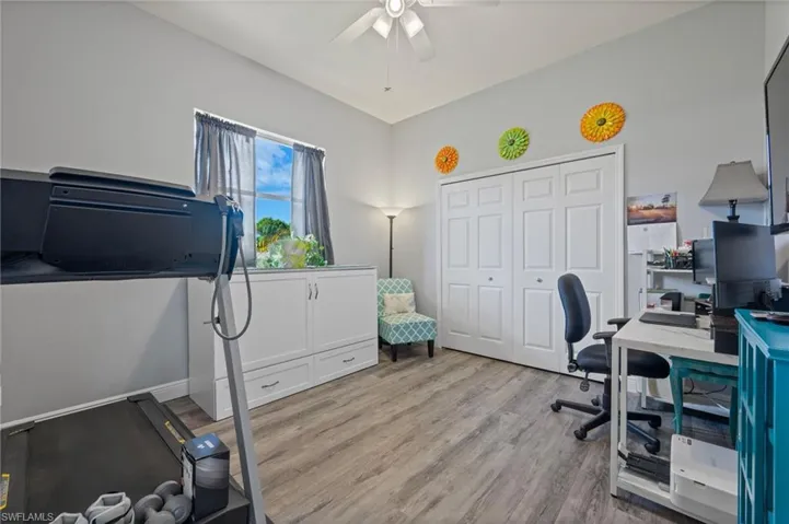 Office space featuring ceiling fan and light wood finished floors