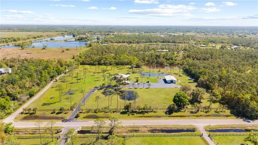 Aerial view featuring a rural view and a water view