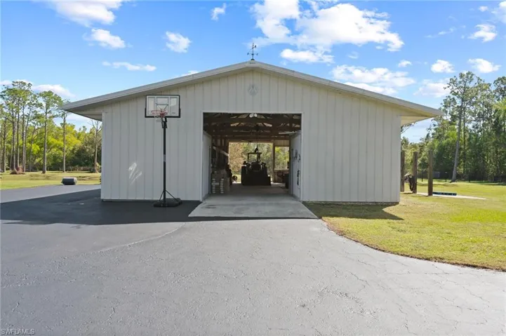 View of outdoor structure featuring an outbuilding