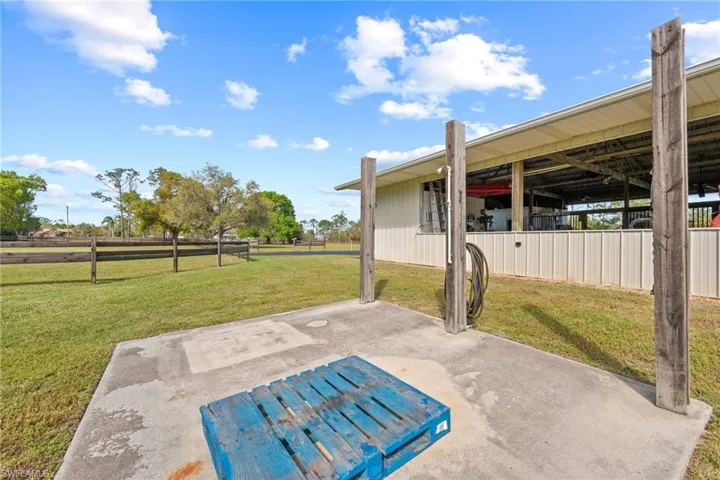View of patio with an exterior structure and an outbuilding