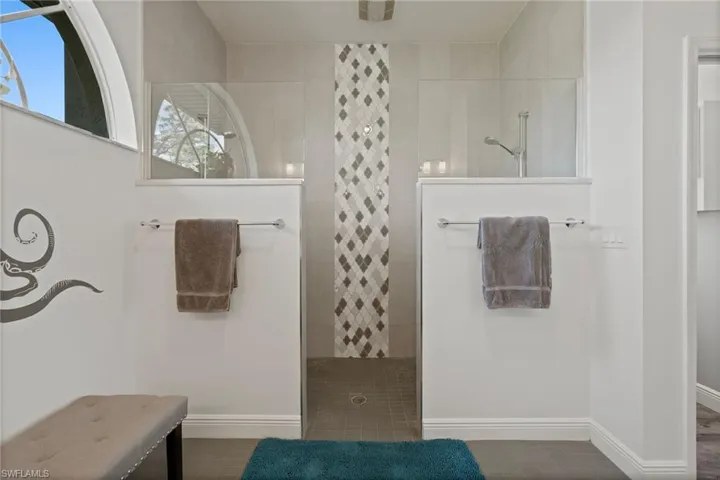 Bathroom with baseboards and a walk in shower