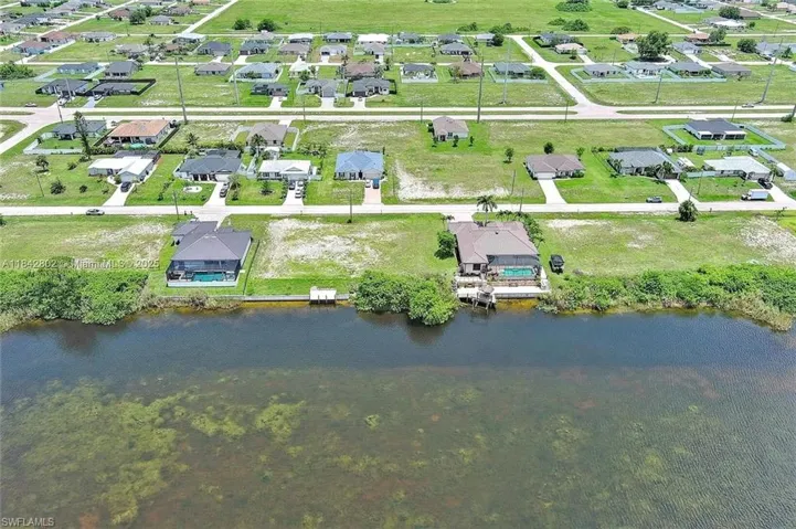 Aerial view of residential area with a nearby body of water