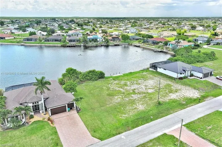 Aerial view of residential area with a nearby body of water