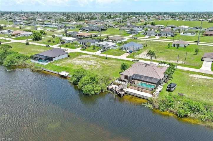 Aerial view of residential area with a large body of water