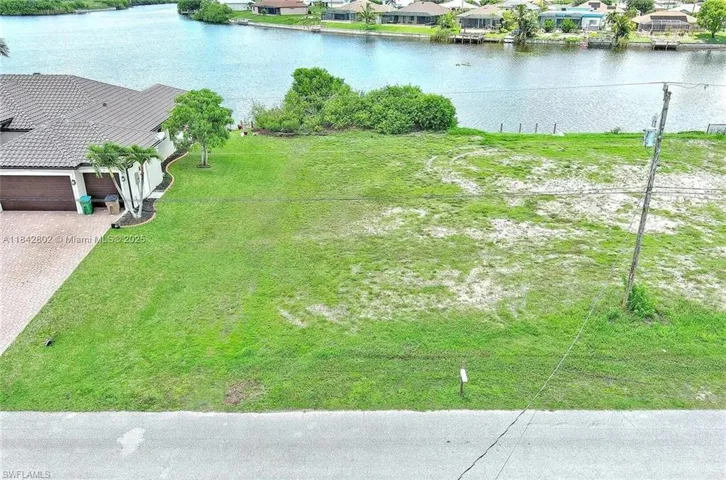 Aerial perspective of suburban area with a large body of water