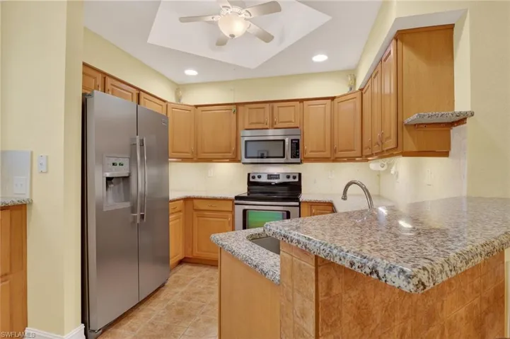 Lots of cabinets, stainless steel appliances