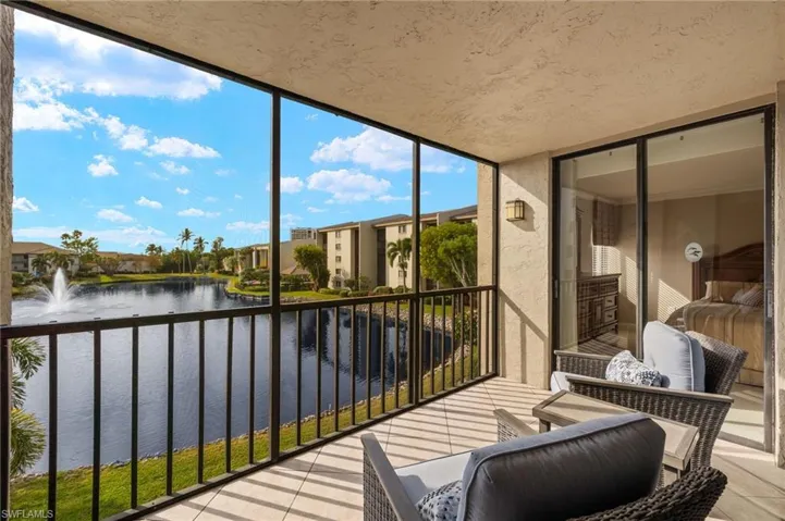 Sunroom with a water view