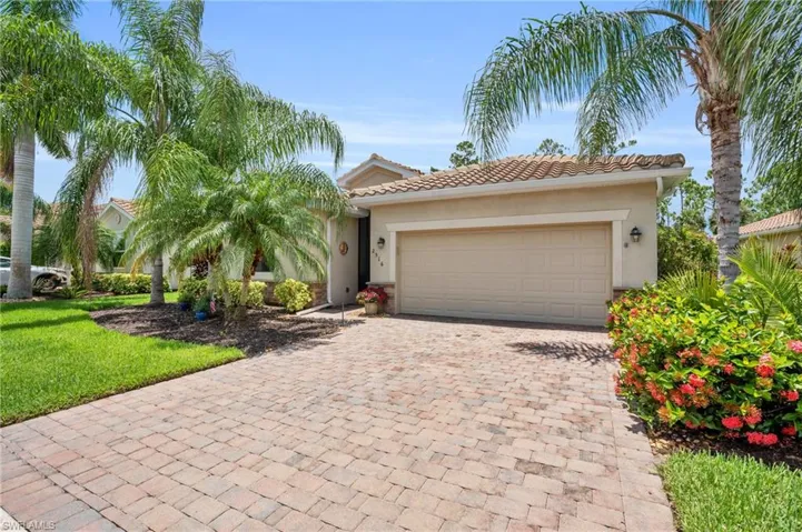 View of front of property featuring a garage