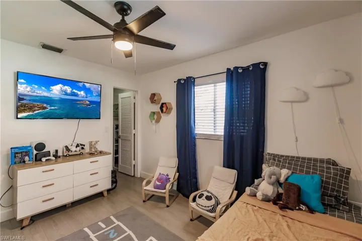 Bedroom featuring ceiling fan and light hardwood / wood-style flooring
