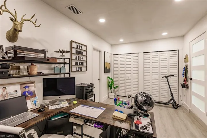 Office space featuring light hardwood / wood-style floors