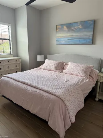 Bedroom featuring dark wood-style floors